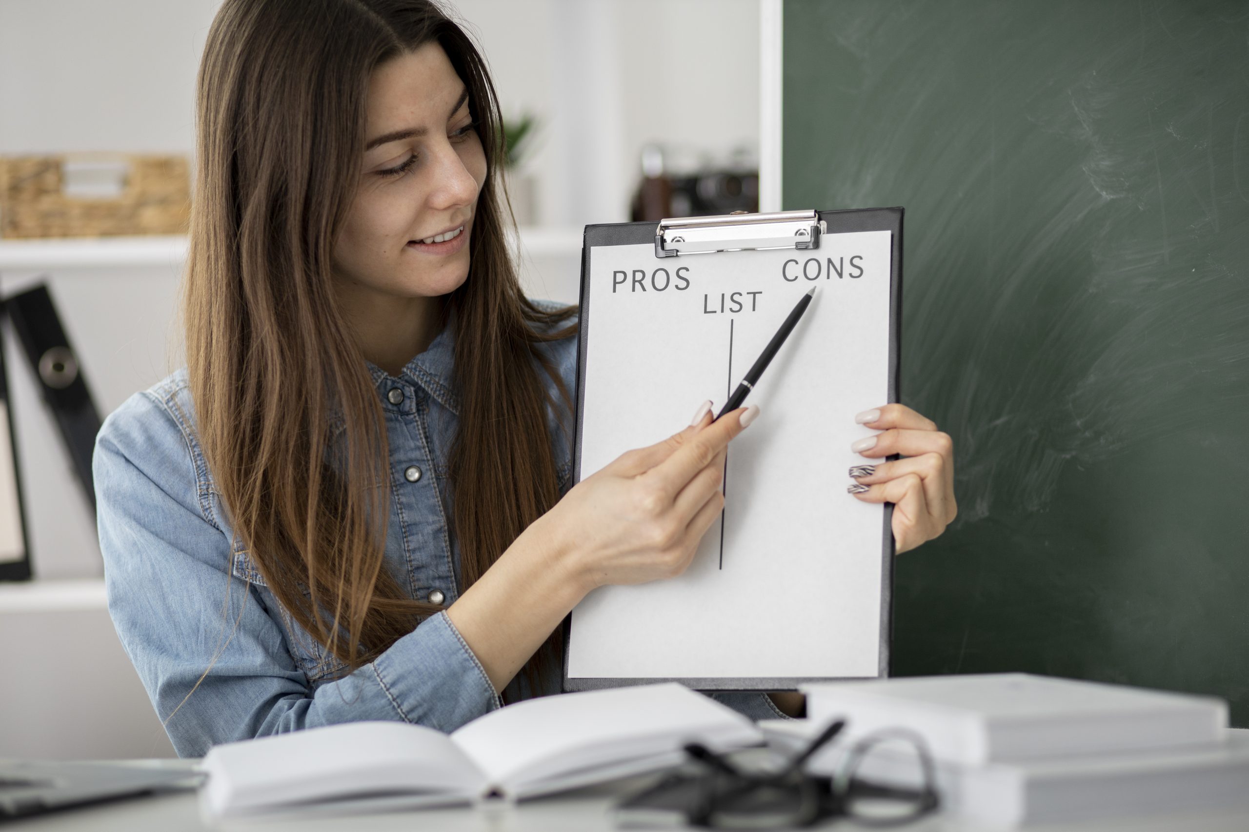 A student brainstorming research topics on a whiteboard with intersecting ideas and question marks.