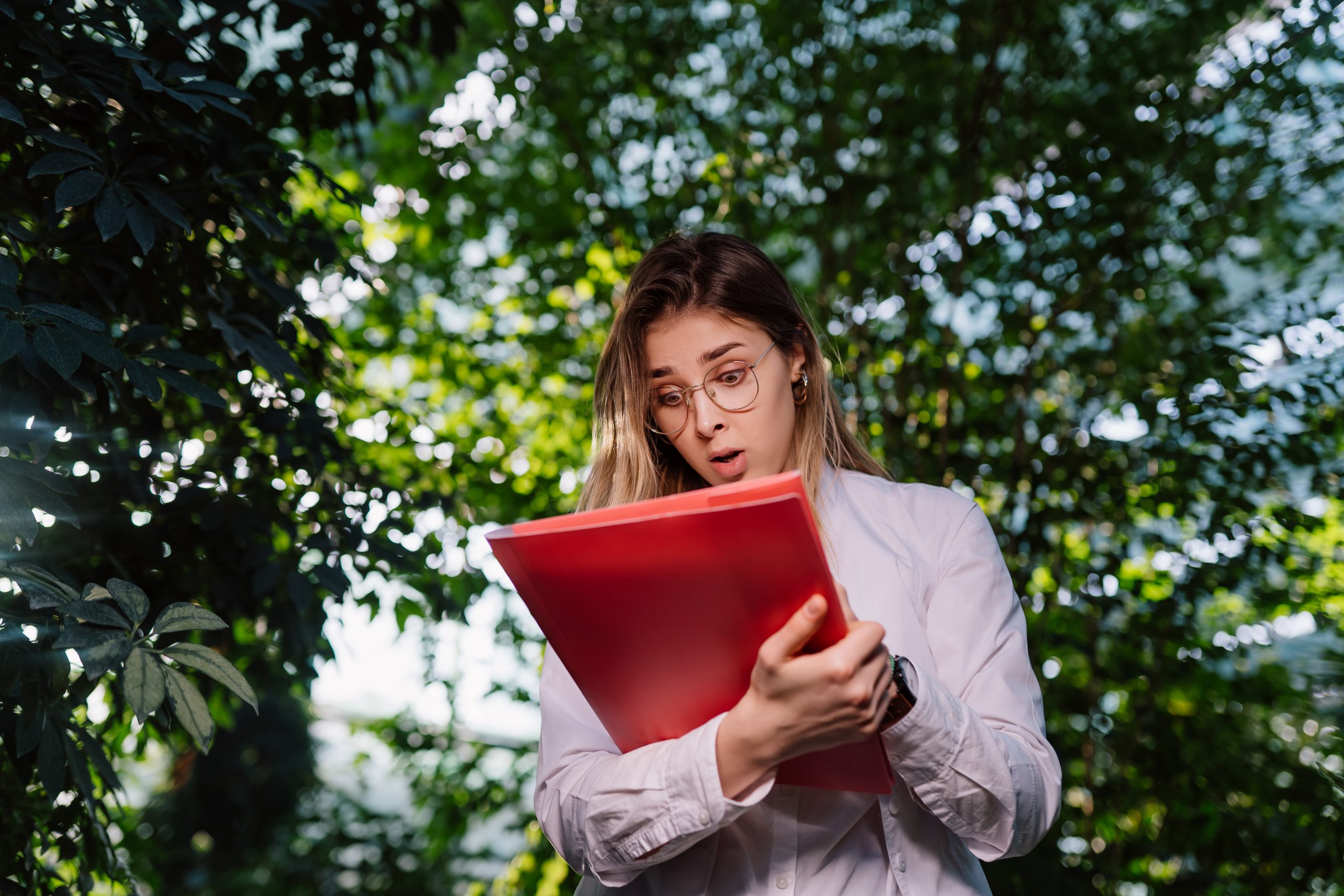 A PhD candidate confidently answering a question during their thesis defense presentation.