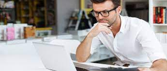 A researcher looking at SPSS output tables and charts for their PhD thesis data analysis.